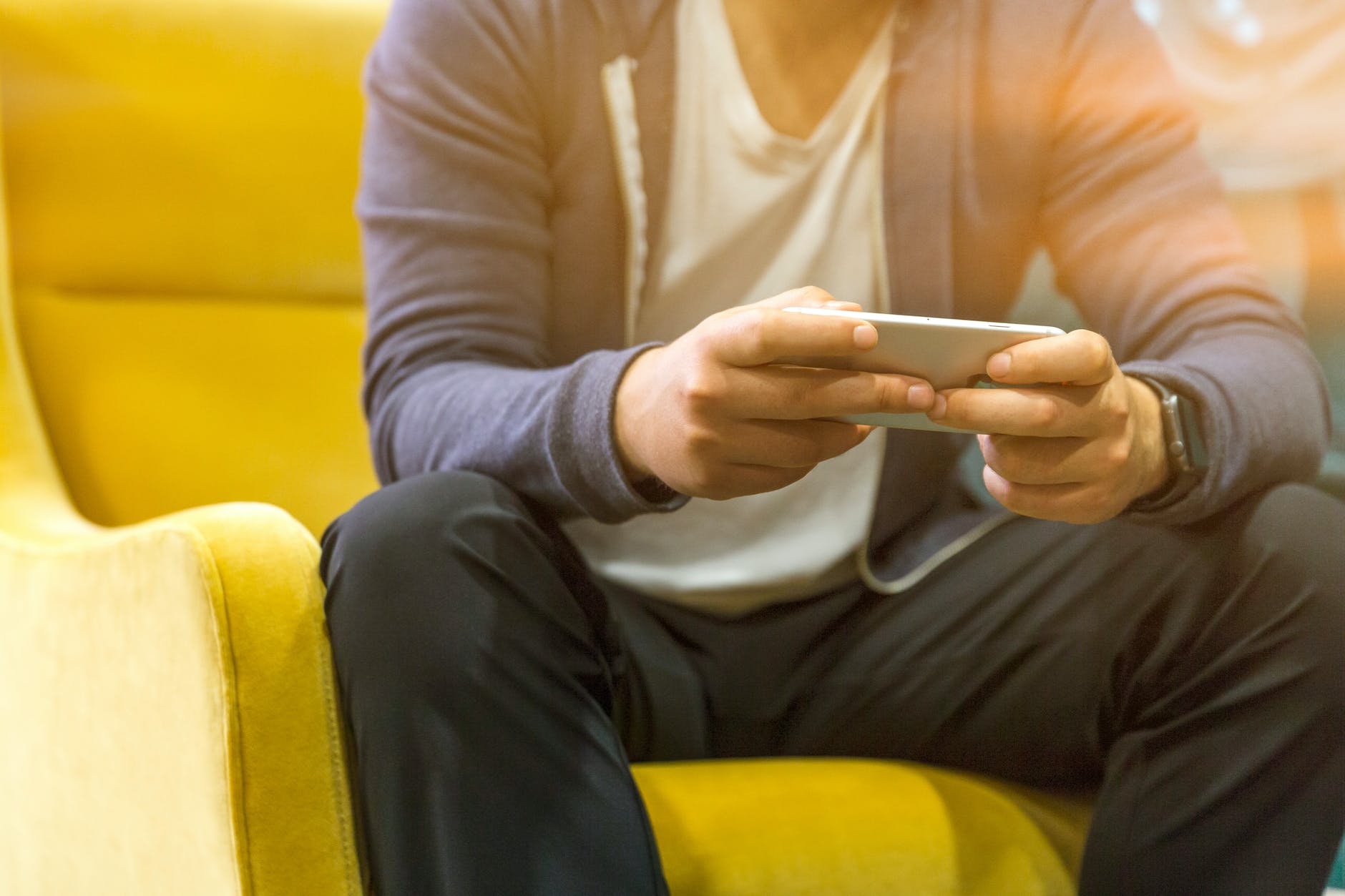 photography of man using mobile phone