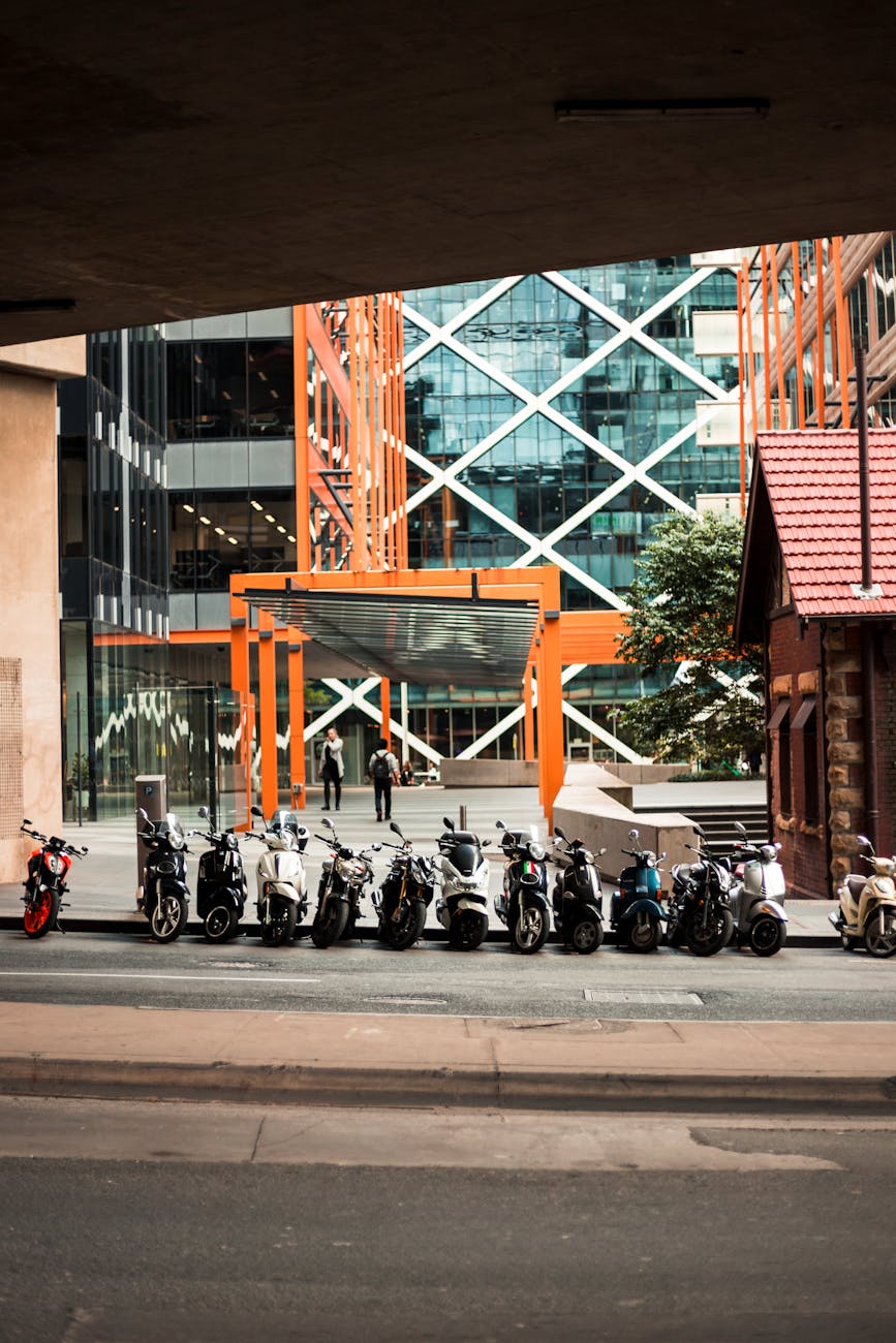 motorcycles parked beside building