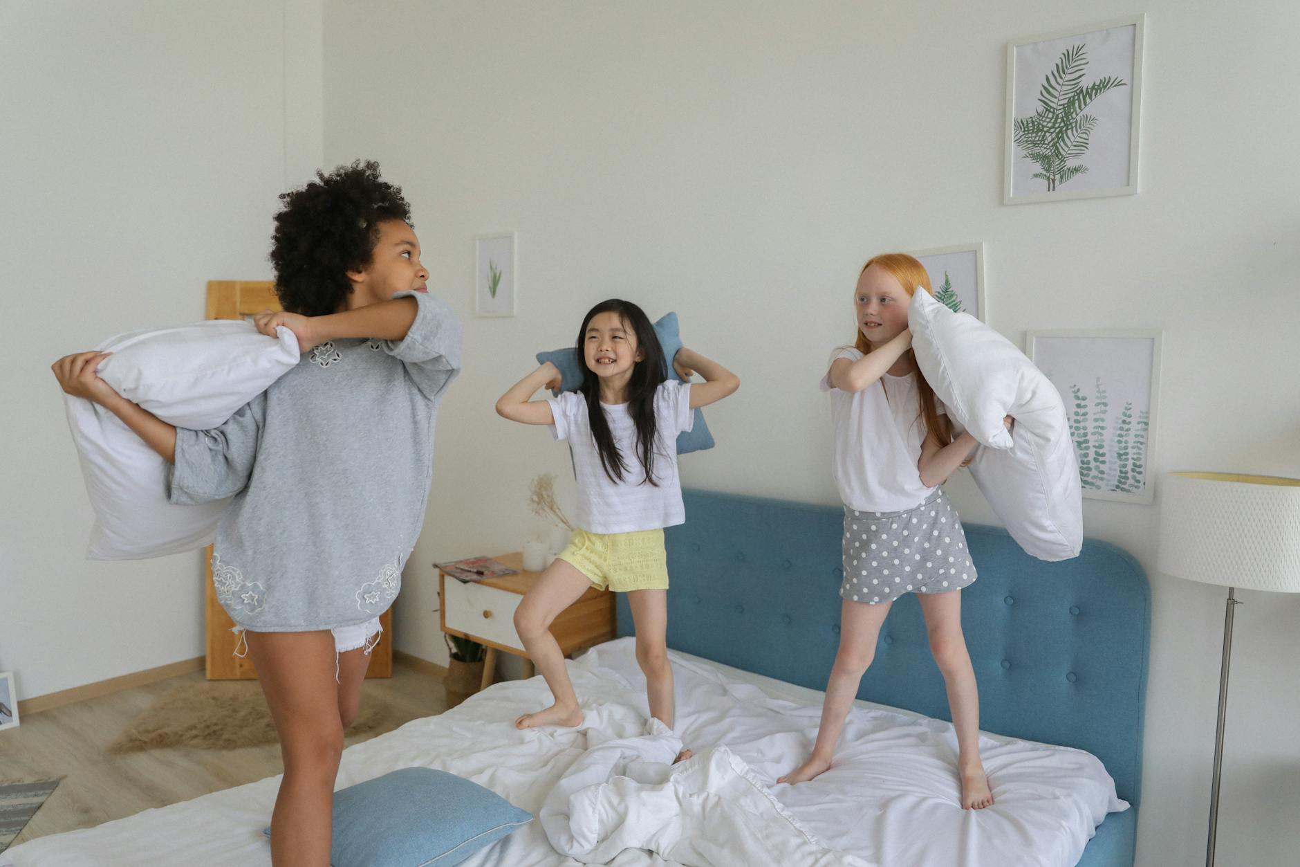 diverse girls playing in bedroom